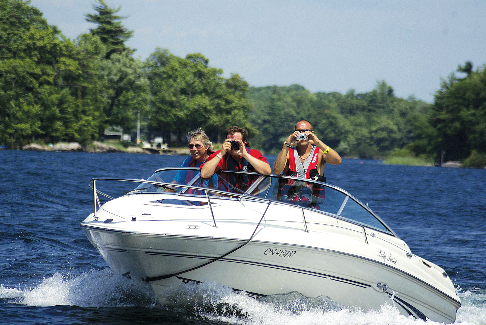 Editor Brad captures a photo of another boat as Doug Johnson navigates the Sea Ray cuddy cabin through the channel