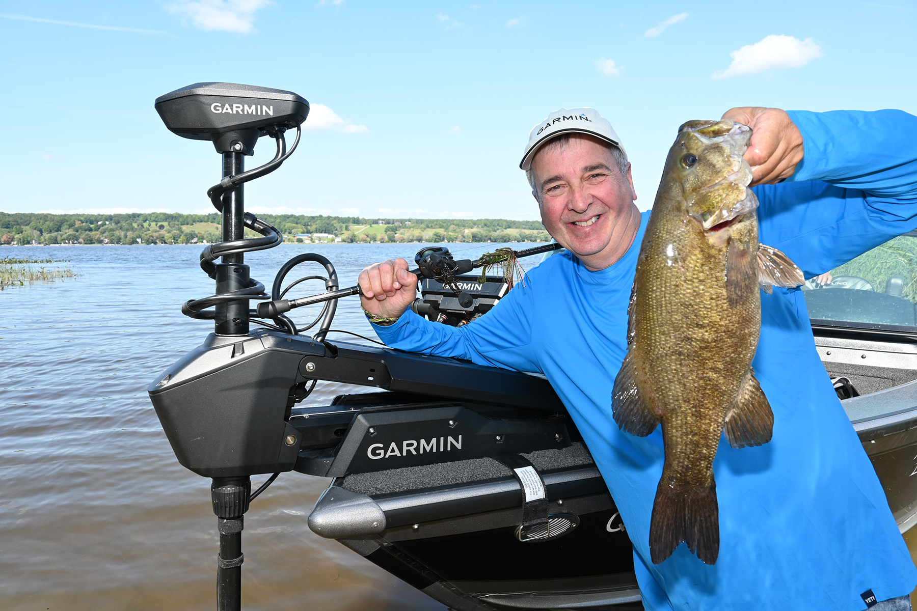 Patrick Campeau holding fish he caught
